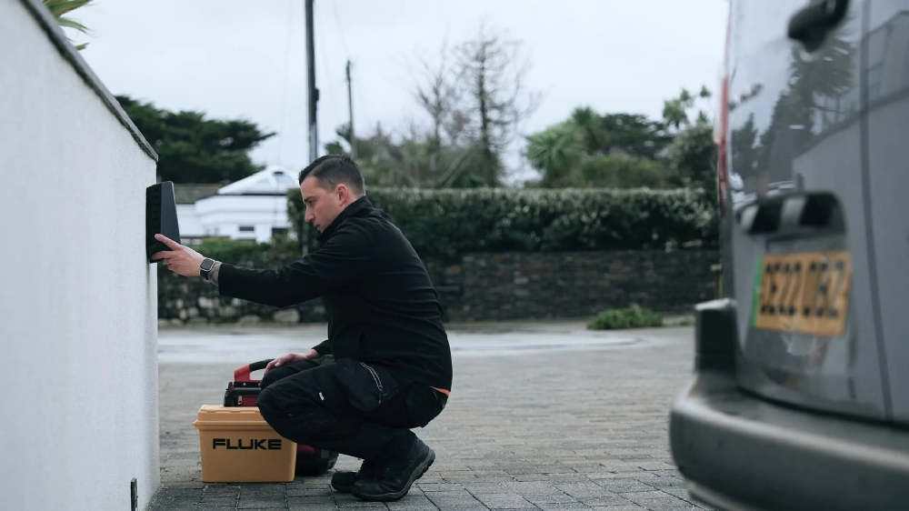 Electrician installing an Easee One EV charger